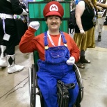 Mario beating the level to get his power up.