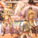 Eren, (top right), Armin (top left), Levi (bottom), figures from Attack on Titian